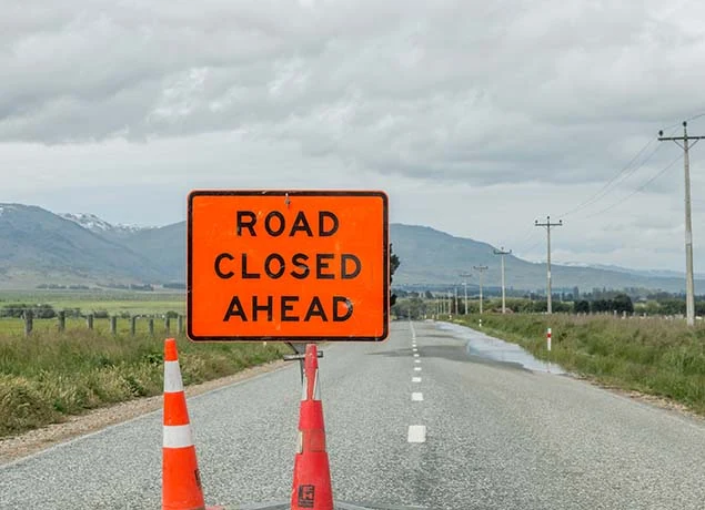 A road closed sign on a New Zealand rural highway