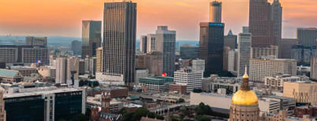 The gold-domed Georgia State Capitol below the downtown Atlanta skyline