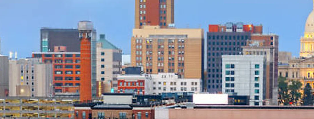 Downtown Lansing at dusk with the Michigan State Capitol dome