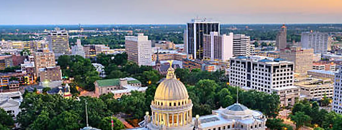 The gold-domed Mississippi State Capitol in Jackson at dusk