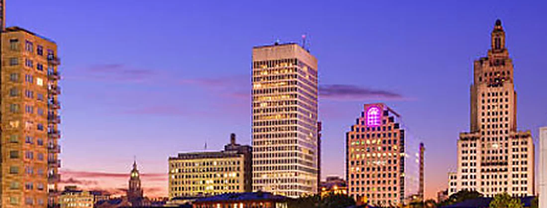 The Industrial Trust Building above the river basin in Providence at dusk